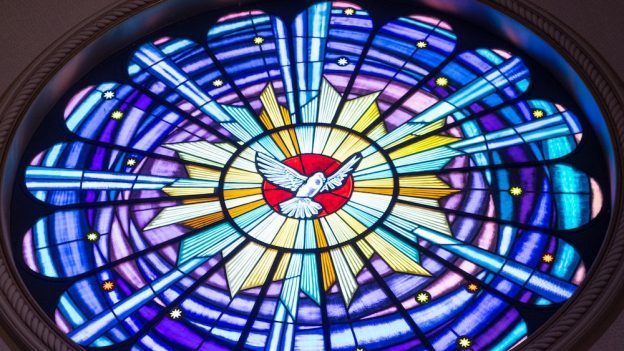 Holy Spirit as dove in church window